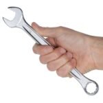 Hand holding a Beta Tools 3/4-inch combination wrench, demonstrating its sturdy construction, ergonomic design, and polished chrome finish. Get it at Wrenchers.com.
