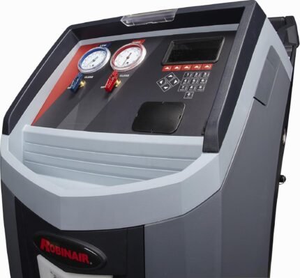 Close-up of the Robinair A/C service machine control panel, highlighting high and low pressure gauges, keypad interface, and durable housing built for heavy-duty auto shop use