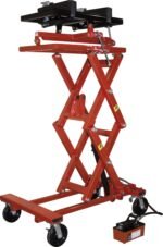 Red hydraulic transmission jack with a scissor-lift design, adjustable saddle, locking brackets, and four swivel casters, shown fully raised with the foot-operated pump attached