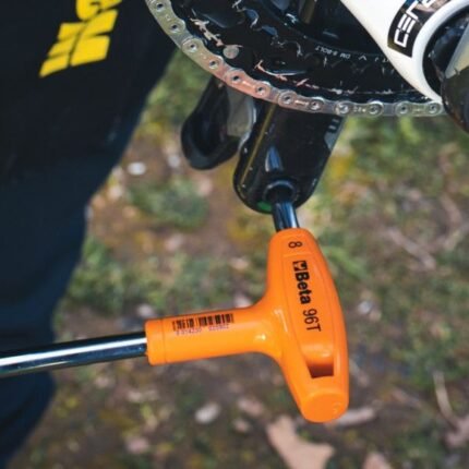 A Beta Tools 5/32 Offset Hexagon Key Wrench tightening a crank bolt, showing precision fit and ergonomic T-handle design for smooth operation. Get it at Wrenchers.com.