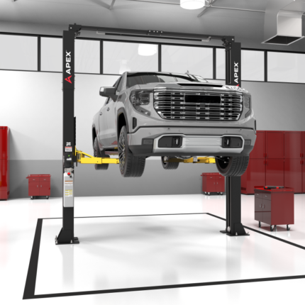 APEX AL10C two post car lift shown in a professional automotive shop bay lifting a full size pickup. A reliable shop lift solution available at