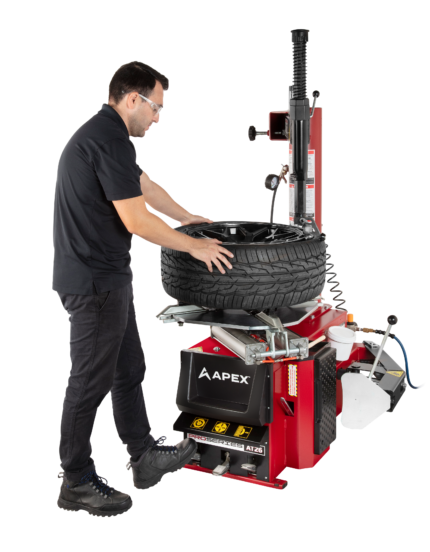 APEX AT26 swing arm tire changer for passenger and light truck wheels in a small shop setting
