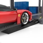 Low clearance car driving on four post lift