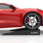 Low clearance vehicle garage ramps with tire stops