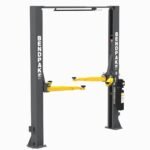 Left front angle of the BendPak 10AP two post car lift showing stable column design and adjustable lift arms for versatile vehicle support. 5175304