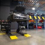 BendPak SP-7XE full-rise lift powering through professional service work with stable 7,000-lb capacity.