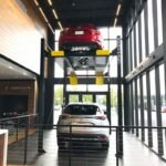 HD 7PXW Stacked Car Display in Dealership by BendPak 5175516 Raised car display solution for dealerships using a premium four-post lift platform.