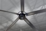 Overhead view of the Cool Boss CB-20 HVLS fan highlighting the six aluminum blades, reinforced mounting hub, and integrated safety cabling