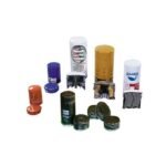 Crushed automotive oil filters shown after processing, flattened metal casings and separated filter elements displayed