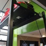 BendPak four-post lift powers bold dealership vehicle displays. SKU 5175516.