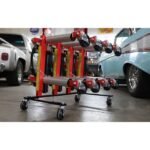 Angled shop view of Ranger GoCart wheel dollies mounted on the mobile storage stand, emphasizing their high-capacity rollers, reinforced frames, and easy maneuverability in tight spaces