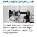 Swing-arm configuration of the Hofmann Monty 1675-SS tire changer providing a compact footprint and ergonomic tire changing position