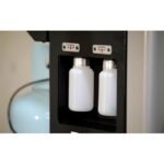 Ranger CoolCharge AC machine new and used oil bottles mounted inside service compartment.