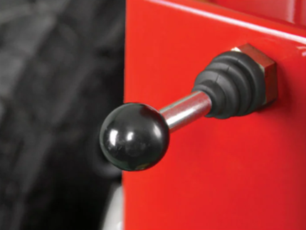Close-up of the control handle on the QSP LM-350 tire lift used to operate the lifting mechanism