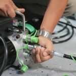 Close-up of the QuickJack BL-3500SLX hydraulic quick-connect fittings for fast setup and teardown. Engineered for leak-free performance and simple operation in any garage environment