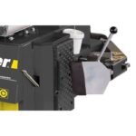 Adjustable bead breaker on the R76LT tire changer applying controlled force to safely separate stubborn tire beads from the wheel rim.