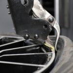 Leverless bead lifter system on R80EX tire changer improving tire service speed, reducing strain, and eliminating the need for tire irons.
