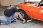 Adjusting Ranger RCD-1500MP vehicle dolly to wheel