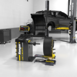 Ranger RWL 175 wheel lift shown in shop use alongside a wheel balancer, enhancing productivity and reducing technician fatigue. Get yours at Wrenchers.com. 5150593