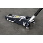Ranger RFJ-4000AL aluminum floor jack shown fully lowered on the shop floor with handle connected